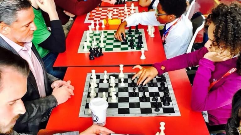 87463225007 a young lauren bradford playing chess against dan gilbert