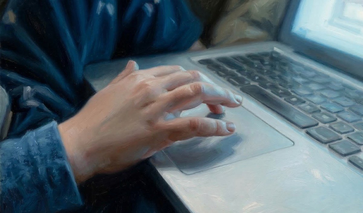 childs hand on trackpad 1