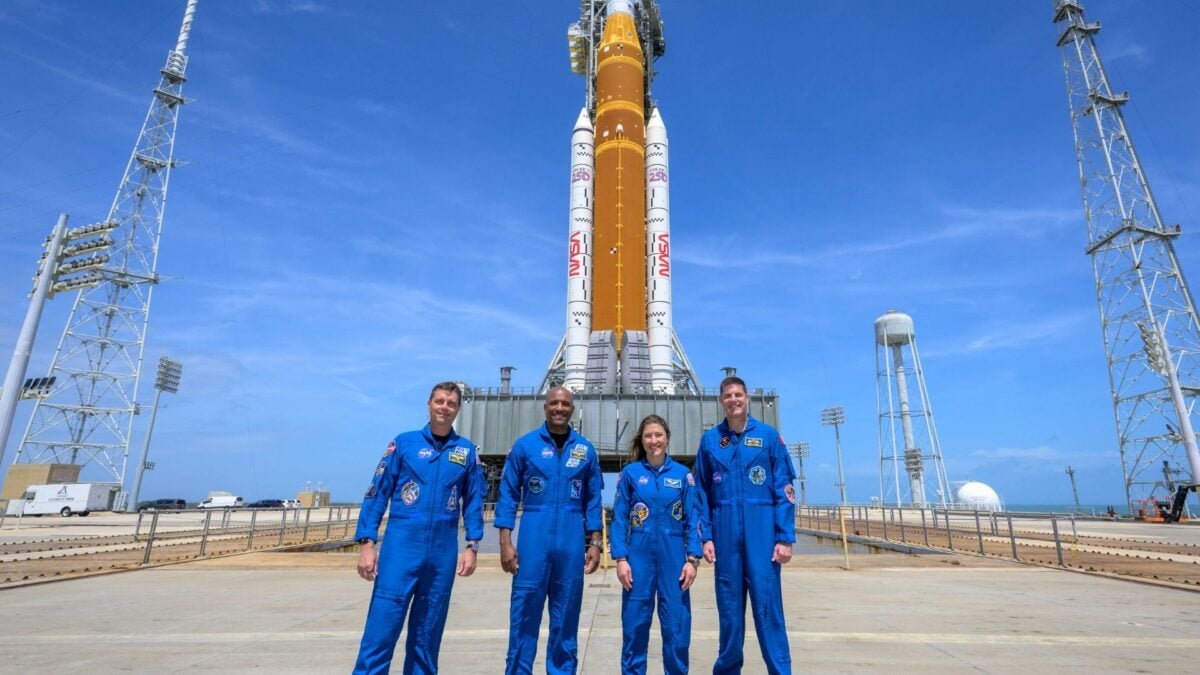 Artemis 2 crew in front of SLS